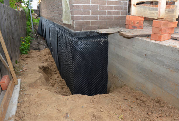 Happy homeowners after waterproofing job in Prattsburgh